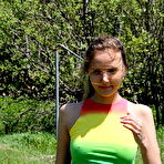 First pic of Young blonde girl unbuttons onesie to show her tits and twat on barrens