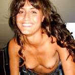 First pic of Topless babe with perky titties stripping off her jeans and panties