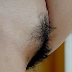 Fourth pic of Skinny Asian gril drops her drawers to expose a meaty and hairy twat