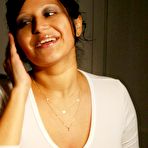 First pic of Pregnant Latina chick licks a nipple during self shot bathroom action