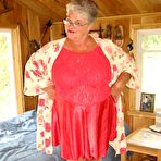 First pic of Short haired granny Girdle Goddess stripping to her stockings and high heels