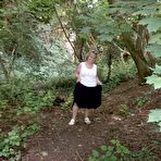 First pic of Mature amateur whore Caro masturbating on the bench in the woods