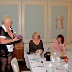 Fourth pic of Fat mature maid serves her guests while wearing revealing clothing