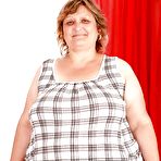 First pic of Fatty granny with huge boobs and ass stripping and spreading her legs