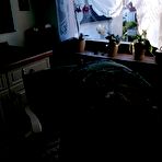 Third pic of Horny granny Caro sticks a banana inside her natural pussy on kitchen chair