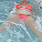 Second pic of Fat nan bares her boobs while in a patio hot tub before getting naked on a bed