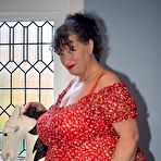 First pic of Fat granny shows her huge boobs and big ass in over the knee boots