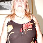 First pic of Fatty granny in nylon stockings stripping and rubbing her slit