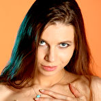 Fourth pic of Gorgeous teen with long hair Clare H gets naked on a section of a tree