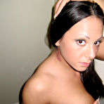 Third pic of Brunette amateur Zoe removes a revealing dress to go topless in a thong