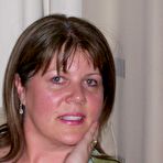 Second pic of Mature lady Cassandra Uk slides her panties aside after showing her nipples