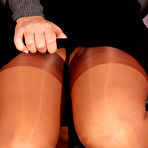 Second pic of Blonde secretary strokes her shaved pussy in FF nylons atop her desk