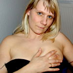 Second pic of Mature amateur smokes a cigarette before masturbating in office chair