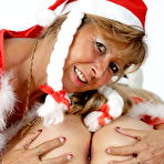 Third pic of Older blonde Sweet Susi and her lesbian lover grab bare asses at Xmas