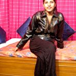 First pic of Indian MILF unveils her natural tits while getting butt naked on a bed