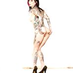 Fourth pic of Tattoed amateur Joanna Angel posing naked after doffing sexy pants