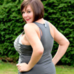 First pic of Amateur plumper Roxy uncovers her huge tits before touching her twat in a yard