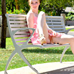 Third pic of Natural redhead Sierra pulls down pink leggings during exhibitionist action