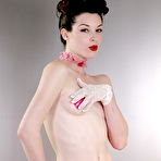 Third pic of Stoya is exposing her small ass and tiny tits in erotic pink lingerie