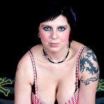 First pic of Tatted girl Fallen Angel fingers her bald pussy after showing her natural tits