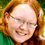 First pic of Ugly redhead chick in glasses strips naked outdoors for pussy spreading
