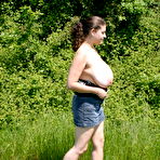Second pic of Dirty amateur MILF Denise Davies worships her large melons in the field