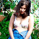 Second pic of Young amateur girl Nikki S shows off her fat rolls after undressing outside