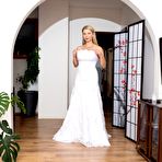 First pic of Sexy blond Katerina Hartlova oils her hooters before toying in a wedding dress