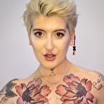 First pic of Tattooed girl sports short hair while showing her firm tits and trimmed muff