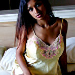 First pic of Sexy Indian girl uncovers round boobs as she slips off satin lingerie