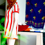 Fourth pic of Redhead Uma J pulls her white panties up over her lovely ass