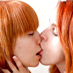 First pic of Young redhead girls Carmina and Uma J use tongues on toes, tits, and cunts
