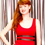 First pic of Young redhead Liz B touts her great boobs as she gets naked in solo action
