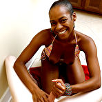 Fourth pic of Naughty ebony girl in bikini milking a white boner with her warm hands