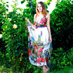 First pic of Big titted teen Dakota Pink gets naked amid a backdrop of lush greenery