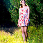 First pic of Young redhead Dakota Pink sports full breasts while showing her bald twat