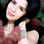 Third pic of Brunette teen Lola Marron strikes great nude poses in front of bushes