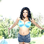 Second pic of Latina MILF revealing big tits and butt from satin lingerie