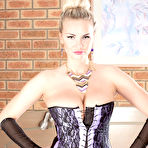 First pic of Hot MILF Marie Lambo frees her nice melons from her corset in back seam nylons
