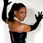Second pic of Ebony mature Semmie Desuora revealing her melons from a classy corset dress