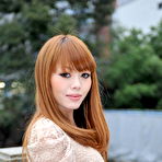 Third pic of Hot Japanese girl with red hair Reika Kitahara poses outdoors in a short dress