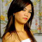 First pic of Slender Asian teen Petite Bunny holds her tight butt while showing her snatch