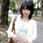 Third pic of Japanese girl Madoka Adachi shows her bare legs during non-nude outdoor action