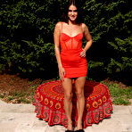 First pic of Brunette teen Bella Modele toys her spread pussy in a backyard setting