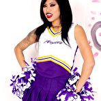 First pic of Asian cheerleader Krissie Dee works free of her uniform in running shoes