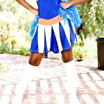 First pic of Ebony girl Ashton Devine lifts cheerleader skirt to flash naked twat on patio