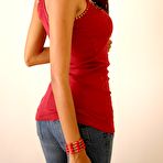 Second pic of Alluring Latina girl Polliana cups her large tits in tight blue jeans