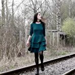 First pic of Brunette girl Lara pees on concrete blocks while walking railway tracks