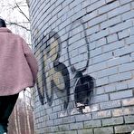 Fourth pic of Caucasian girl Vasya pisses up against a brick wall in winter clothing