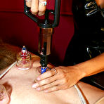 First pic of Blonde mistress tortures a restrained male slave during femdom play